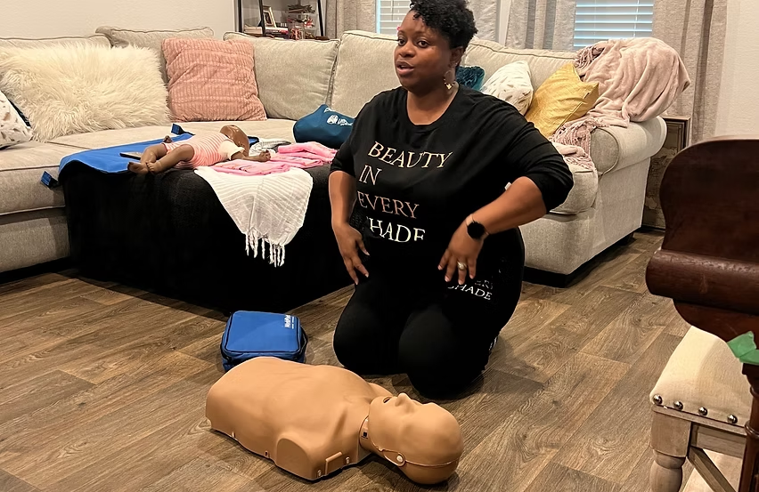 G. Harvey demonstrating infant CPR during a MILK training session